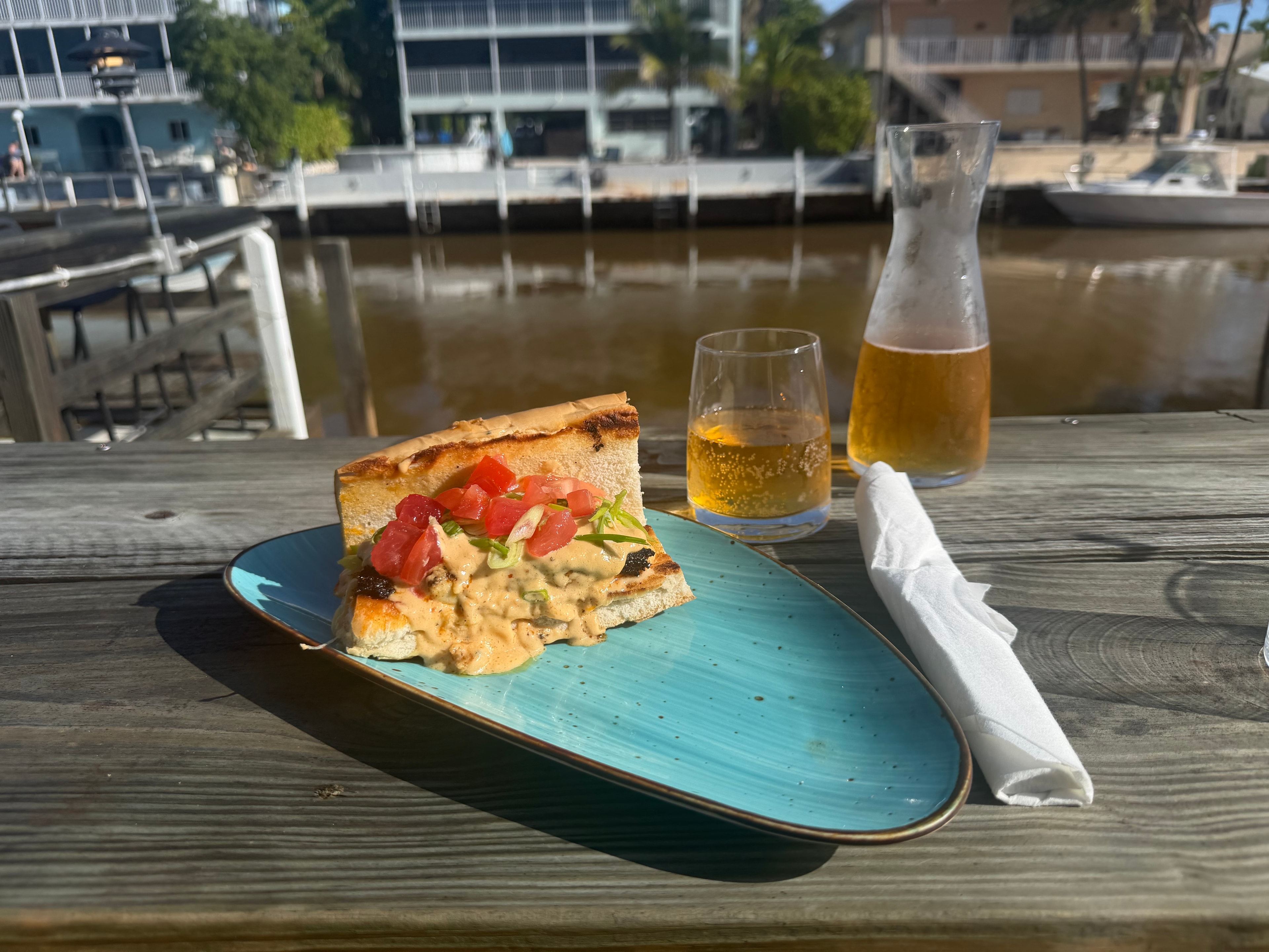 Hot Tin Roof sandwich with wine carafe on the Buttonwood Grill waterfront deck